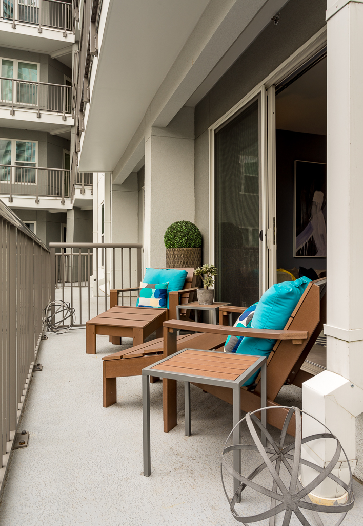 Outdoor patio area with wood chairs for seating